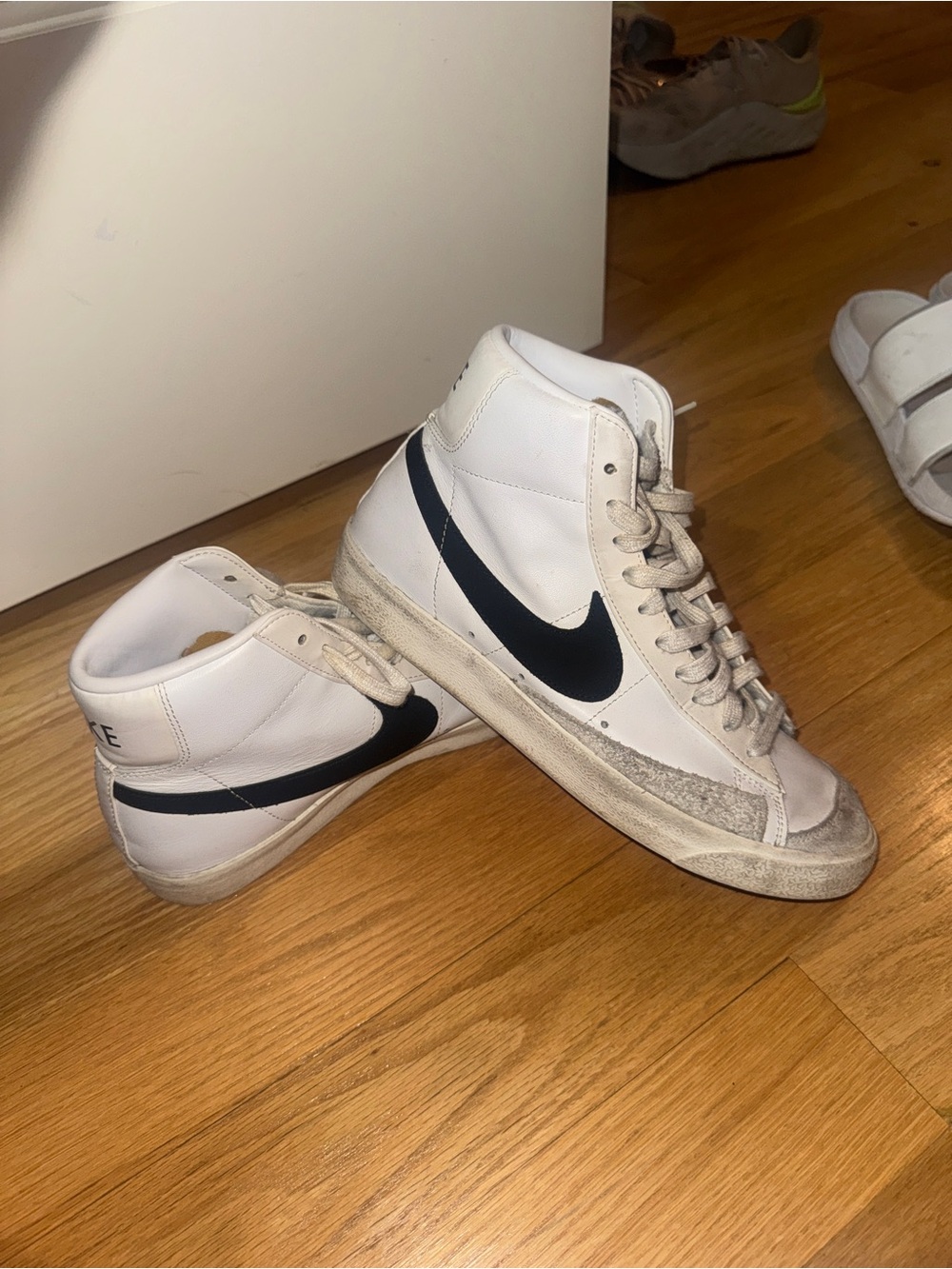 Nike White High-Top Sneakers with Black Swoosh